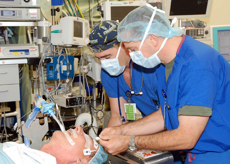 Anesthesiologist and Anesthesiologist Assistant sedating a patient before surgery