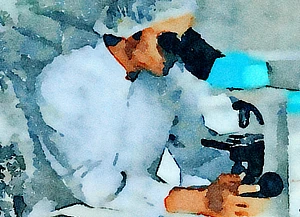 A healthcare worker sitting at
                     a table and looking through a microscope