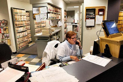 medical assistant making a phone call